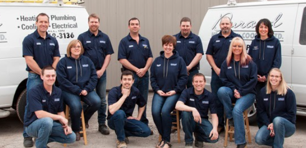 Plumbing company photo with employees and vans